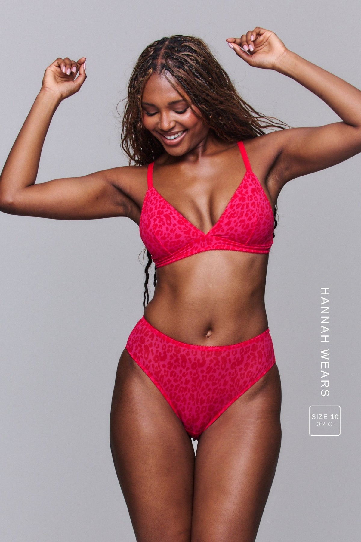 A woman modelling a Pink Leopard Print Mesh Bralette paired with a matching brief