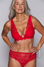 A woman modelling a red lace lingerie set ^Lolly | Size: 32 E / 12