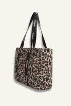 Leopard print tote bag with black strap on a white background