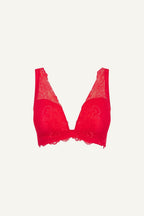 A ghost image of the front of a red lace push up bra 