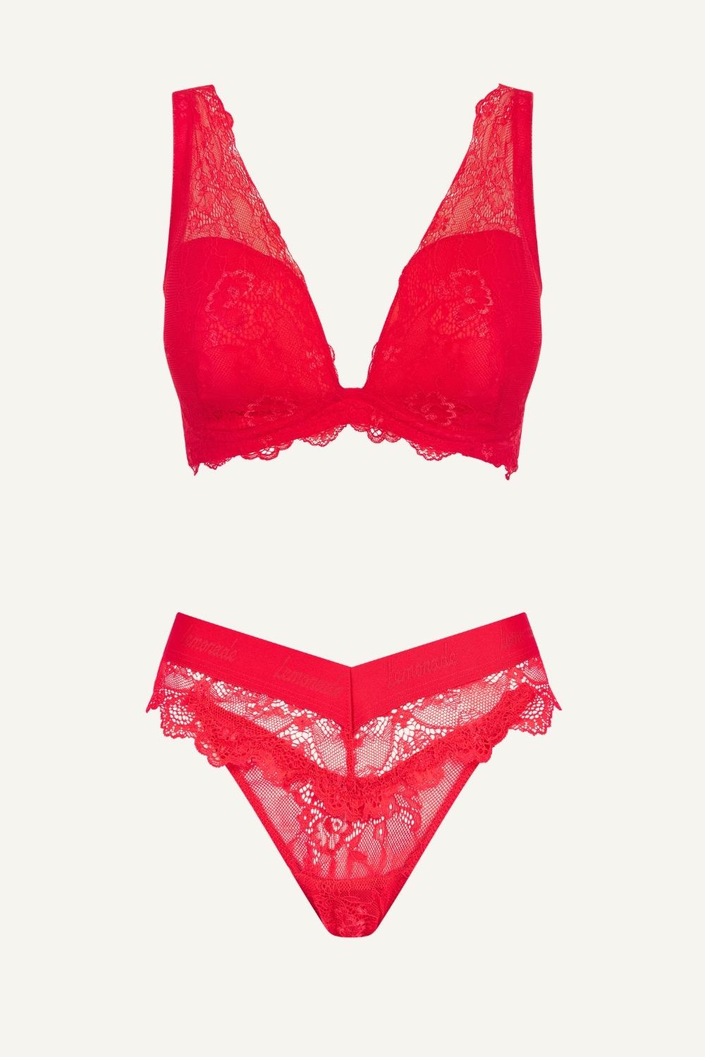 Red lace lingerie set on a white background