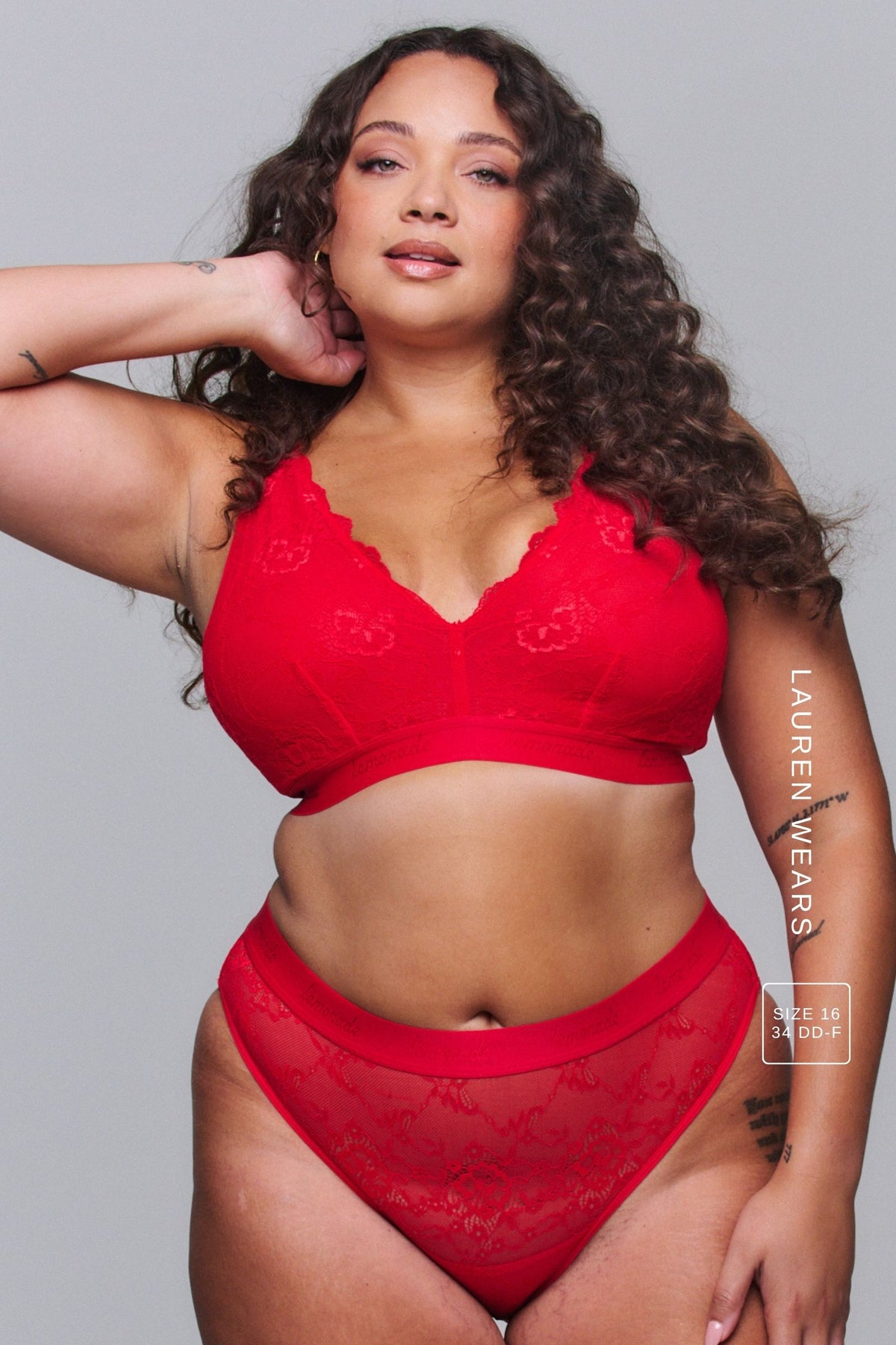 A woman modelling a Red Lace Brief paired with a matching bralette 
