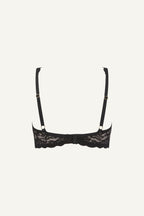 A ghost image of the back of a black silhouette lace bra 