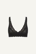 a ghost image of a black silhouette lace bra 