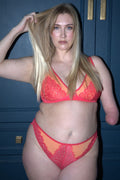 a woman wearing an orange lingerie set ^Kelly | Size: 36 DD-F / 14