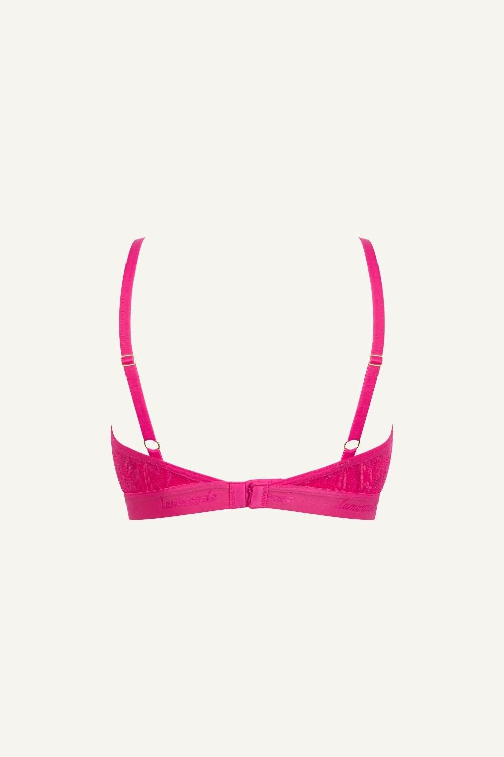 A ghost image of the back of a pink lace bralette called "iridescent" 