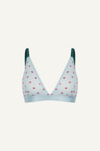 A ghost image of the front of a blue mesh bralette with pink hearts on it and green straps 