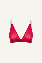 A ghost image of the front of a red mesh bralette with blue straps and small pink hearts on it 