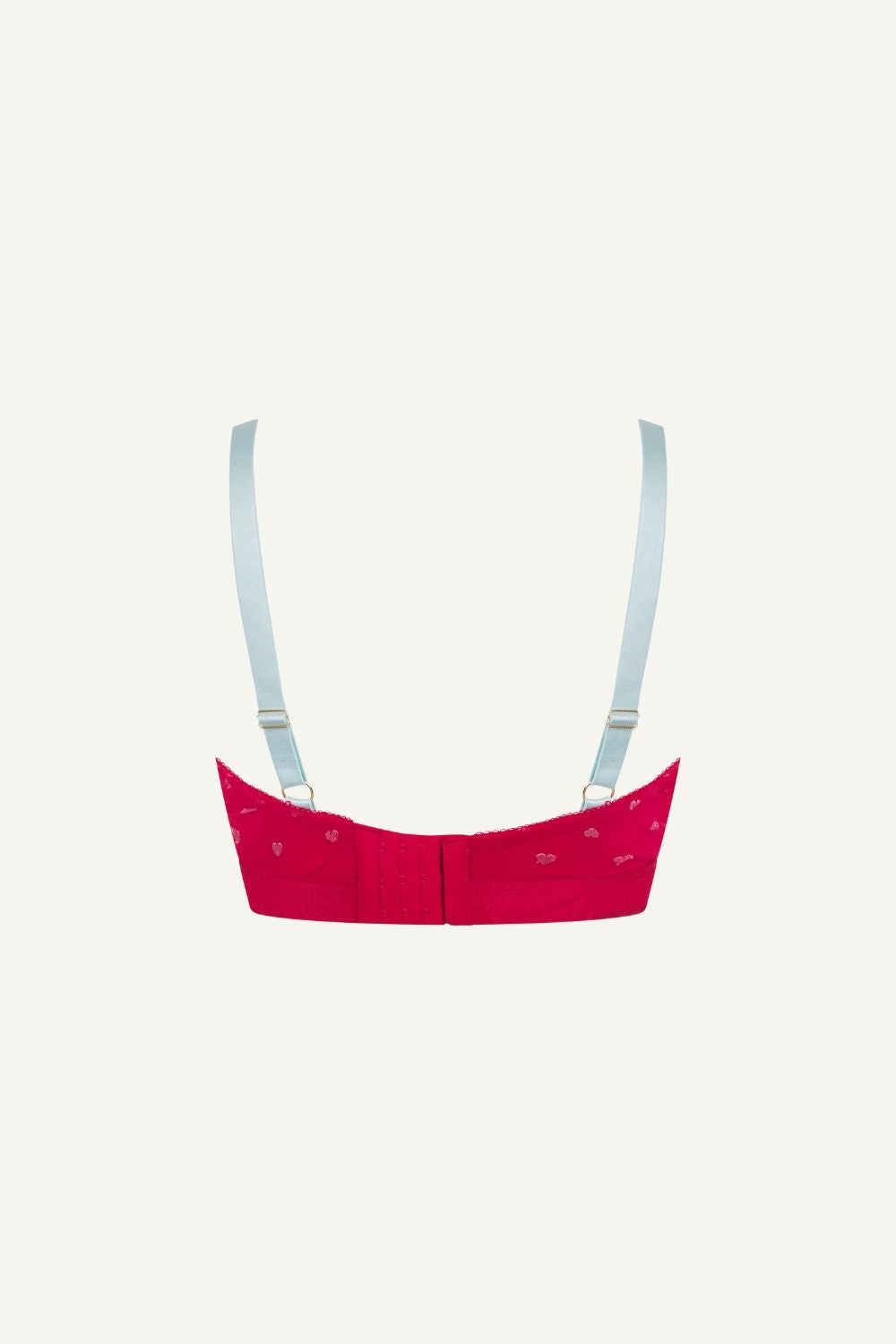 A ghost image of the back of a red mesh fuller cup bralette with small hearts on it 