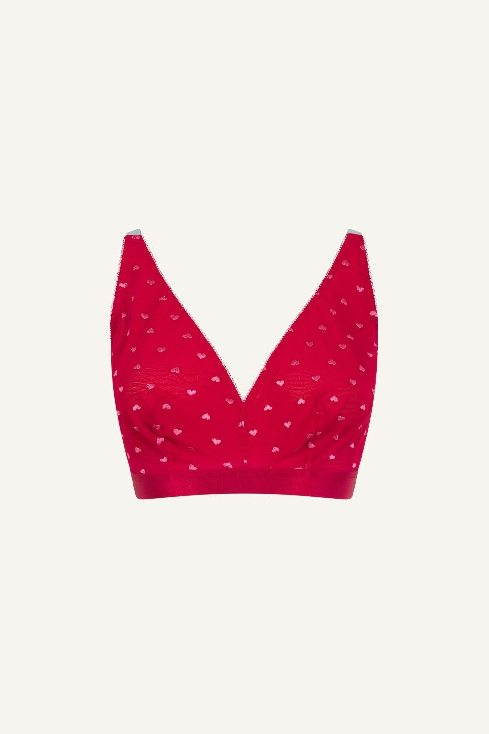 A ghost image of the front of a red mesh fuller cup bralette with small hearts on it