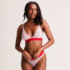 A woman wearing a light pink lace bralette  ^Hannah | Size: 32 B / 8