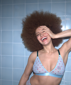 A woman wearing a blue mesh bralette with small pink hearts on it and green straps ^Yasmin | Size: 32 C-D