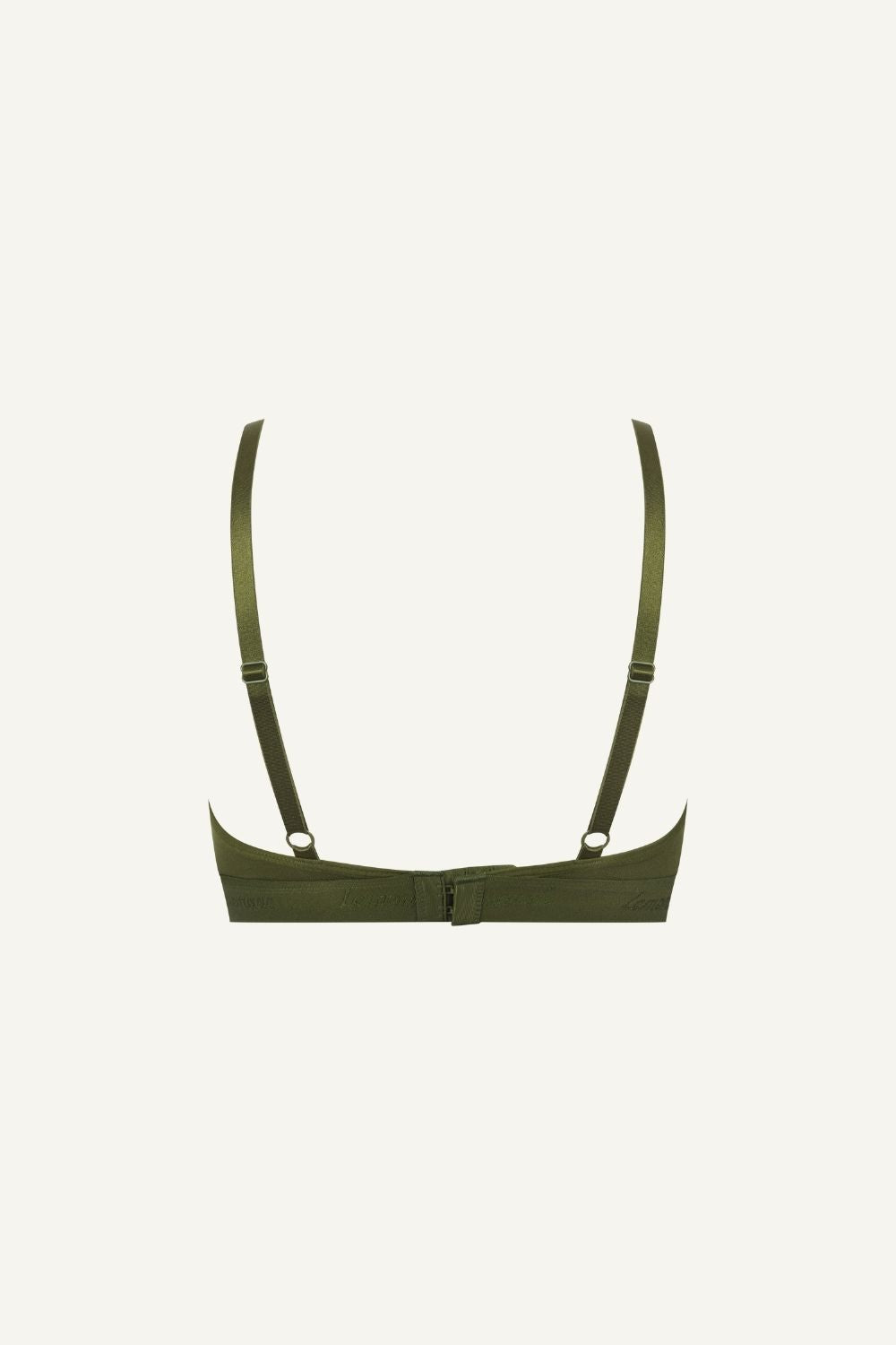 A ghost image of the back of a green mesh bralette 