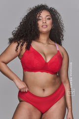 a woman modelling a red bra with pink straps paired with matching knickers 