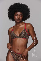 Model wearing a leopard print lingerie with red straps ^Kendra | Size: 32 A-B / 8