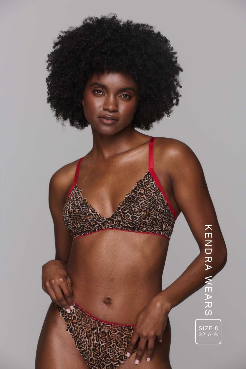 Model wearing a leopard print lingerie with red straps ^Kendra | Size: 32 A-B / 8