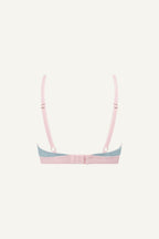 A ghost image of the back of a light blue lace bralette with light pink straps 