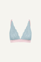 A ghost image of a light blue lace bralette 
