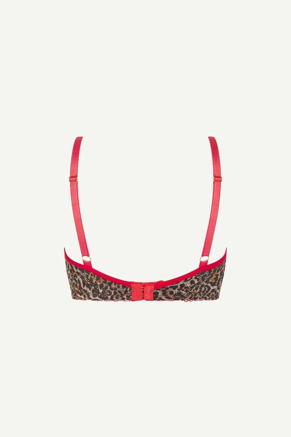 a ghost image of a leopard print lace bralette with red straps 