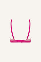 A ghost image of the back of a two toned pink lace bralette 