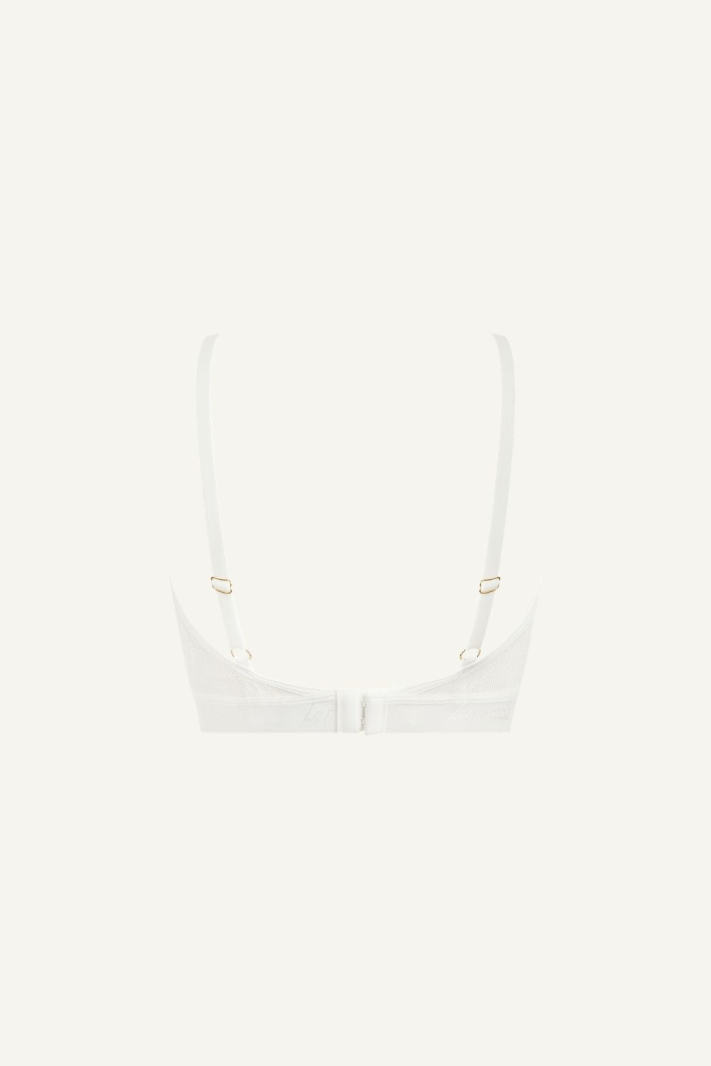 A ghost image of the back of a white lace bralette 