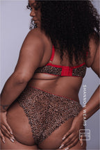 A woman standing with her back to showing the back of a leopard print lace lingerie set ^Shannon | Size: 36 FF-G 