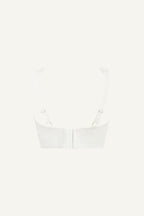 A ghost image of a white lace fuller cup bralette 