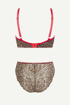 a ghost image of the back of a matching leopard print mesh lingerie set with a red detail 