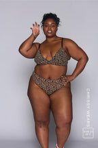 A woman doing a facial expression and wearing a lepard print mesh bralette with black straps paired with matching briefs^Chrissy | Size: 42 C / 22