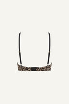 A ghost image of the back of a leopard print mesh bralette with black straps 