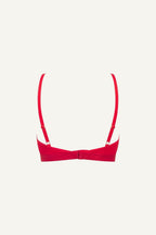A ghost image of the back of a red mesh bralette 