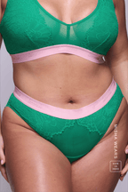 A woman wearing a green lace fuller cup bralette with the matching briefs ^Misha | Size: 38 DD / 16