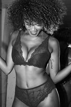 A woman on a black and white image modelling a black lace push up bra ^Kelly | Size: 32 FF/12