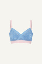 a ghost image of a pink and blue high support lace bra called The One 