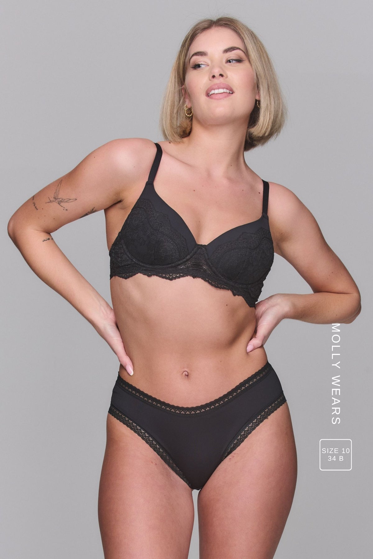 Woman wearing a black bra called The flex and a soft black Brief 