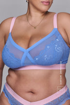 A close up image of a woman wearing a blue and pink lace matching lingerie set ^Roxanne | Size: 36 H / 16