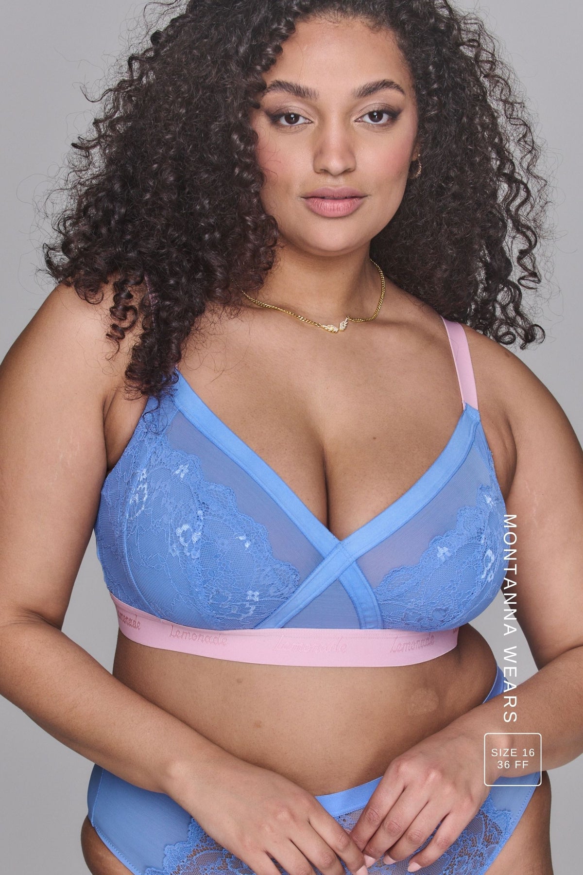 A woman wearing a pink and blue high support lace bra called The One paired with matching knickers ^Montanna | Size: 36 FF / 16