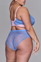 A woman standing with her back to wearing the Signature Lace and Mesh HW brief – Blue paired with the matching fuller cup bralette 