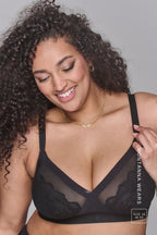 A woman wearing a black lace fuller cup bra called the one 