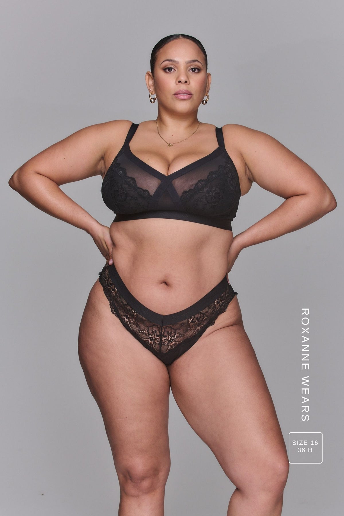 A woman modelling The One Signature Lace High Support Black Bra, paired with a matching black brief 