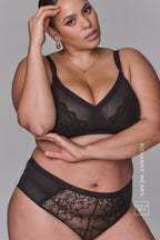 A woman modelling a Black Lace High Waist Brief paired with a matching black bra ^Roxanne | Size: 36 H / 16