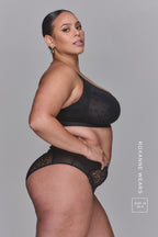 A woman modelling a Black Lace High Waist Brief paired with a matching black bra