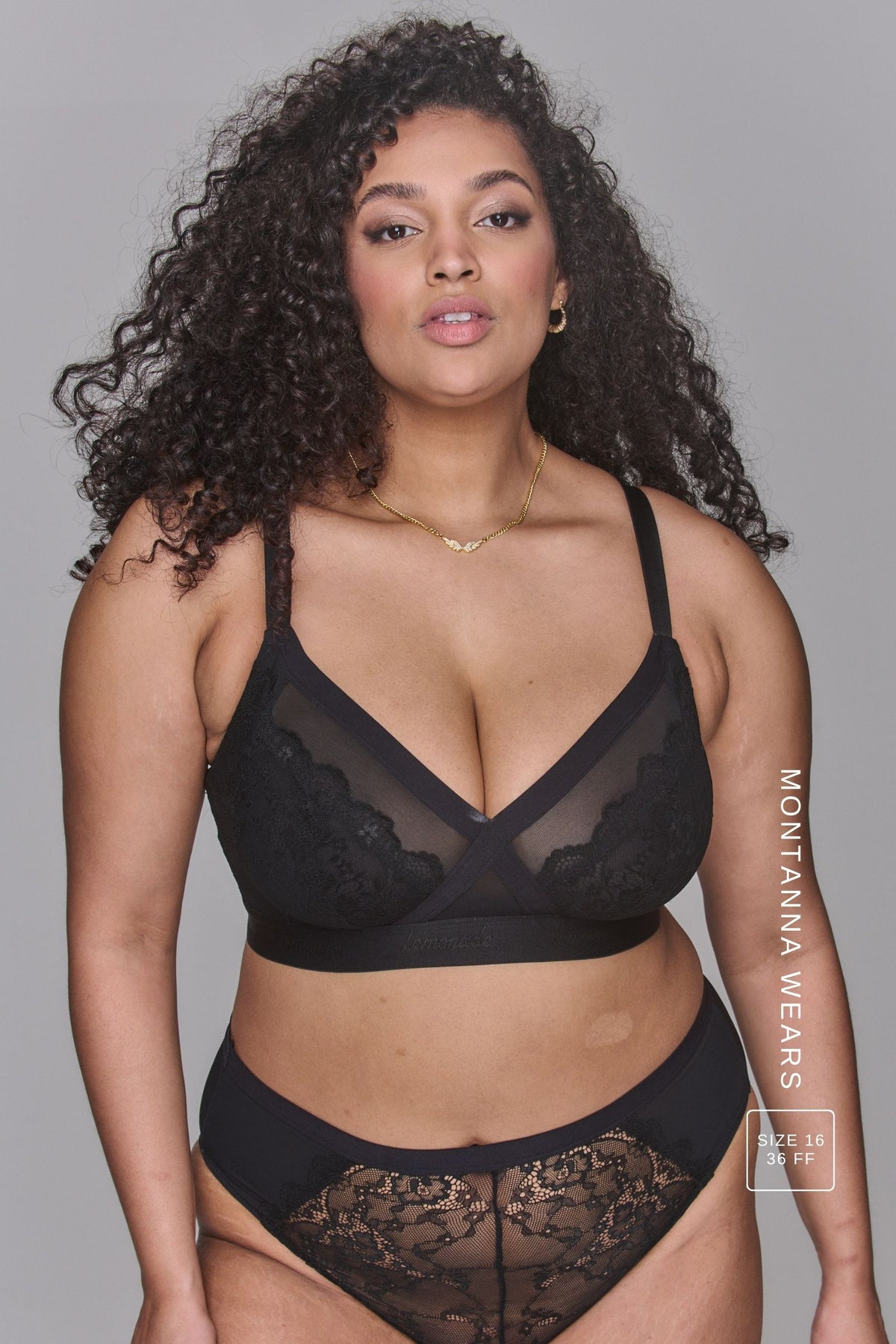 A woman modelling a Black Lace High Waist Brief paired with a matching black bra ^Montanna | Size: 36 FF / 16