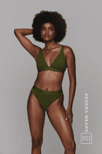 A woman wearing a khaki green lingerie set ^Kendra | Size: 32 A-B / 8