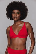 A woman wearing a red mesh bralette paired with matching knickers ^Kendra | Size: 32 A-B / 8