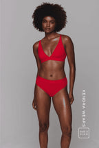A woman wearing a red modal brief and a matching bralette  ^Kendra | Size: 32 A-B / 8