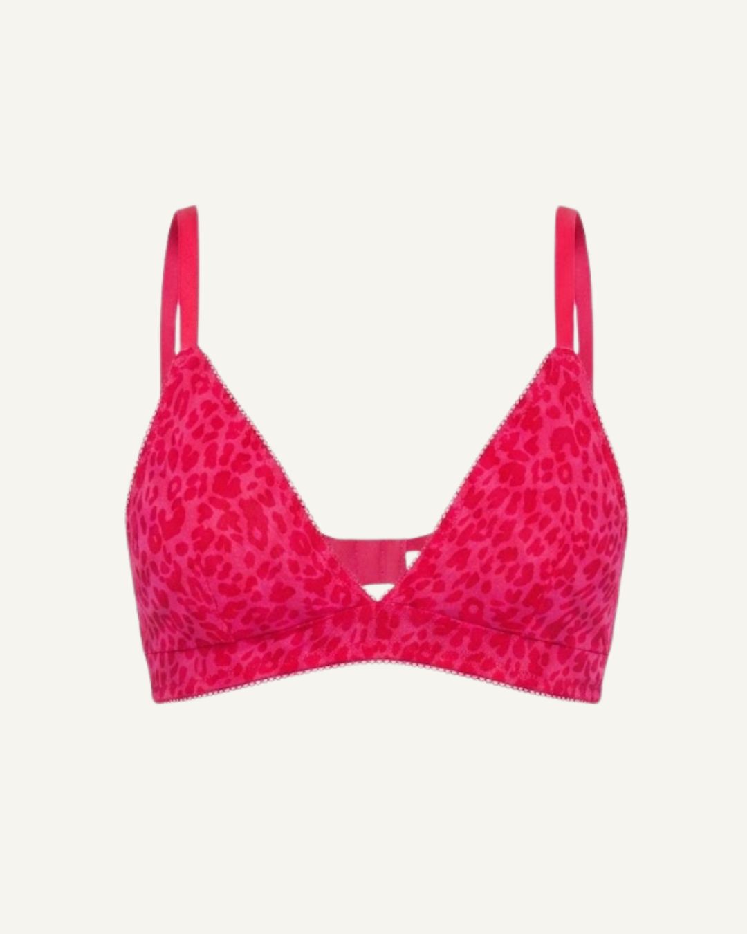 A ghost image of the front of a pink leopard print mesh bralette 