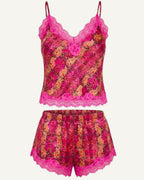 A two-piece lingerie set featuring a floral lace camisole top and matching shorts in vibrant pink, magenta, and orange tones, set against a plain off-white background.