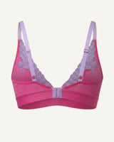 A ghost image of the back of a pink and purple lace embroidered bralette