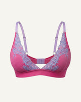 A ghost image of the front of a pink and purple lace embroidered bralette 